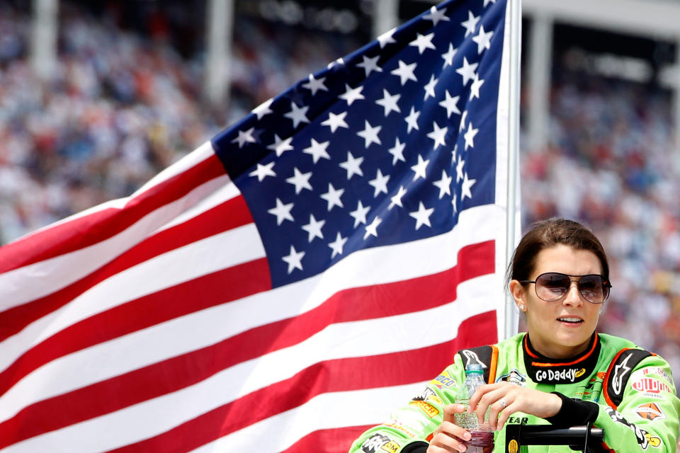 CONCORD, NC - MAY 26: Danica Patrick, driver of the #7 GoDaddy.com Chevrolet, looks on from a truck during driver introductions prior to the NASCAR Nationwide Series History 300 at Charlotte Motor Speedway on May 26, 2012 in Concord, North Carolina. (Photo by Tyler Barrick/Getty Images for NASCAR)
