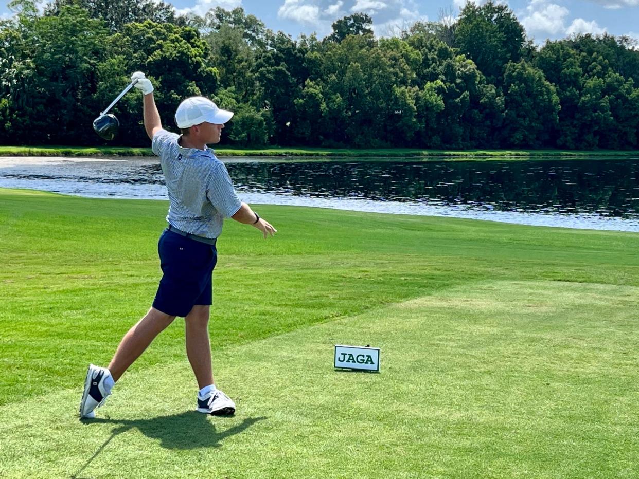 Jason Duff watches his tee shot at No. 10 at the Deerwood Country Club sail to the left and in a hazard during the second round of the Jacksonville Amateur on Friday. Duff bounced back from the double bogey to maintain his lead in the tournament.