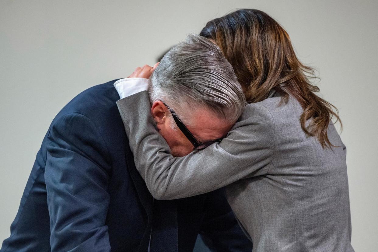 <span>Alec Baldwin and his wife, Hilaria, hug during his trial for involuntary manslaughter for the 2021 shooting of Halyna Hutchins.</span><span>Photograph: Eddie Moore/AP</span>