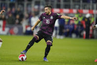 FILE - Mexico's Hector Herrera controls the ball during the second half of a FIFA World Cup qualifying soccer match between Mexico and the United States, Friday, Nov. 12, 2021, in Cincinnati. The U.S. won 2-0. (AP Photo/Julio Cortez, File)