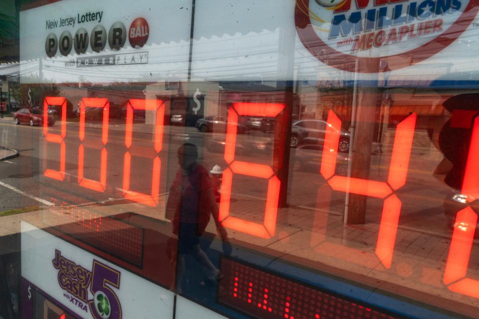 Customers try their luck on the $900M Powerball at Union Food Store in Totowa, NJ on Monday July 17, 2023. 