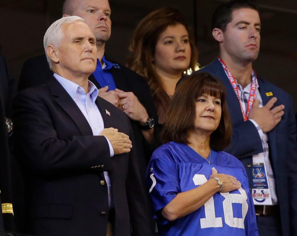 Vice President Mike Pence and his wife, Karen, stand during the playing of the national anthem before an NFL football game between the Indianapolis Colts and the San Francisco 49ers, Sunday, Oct. 8, 2017, in Indianapolis.