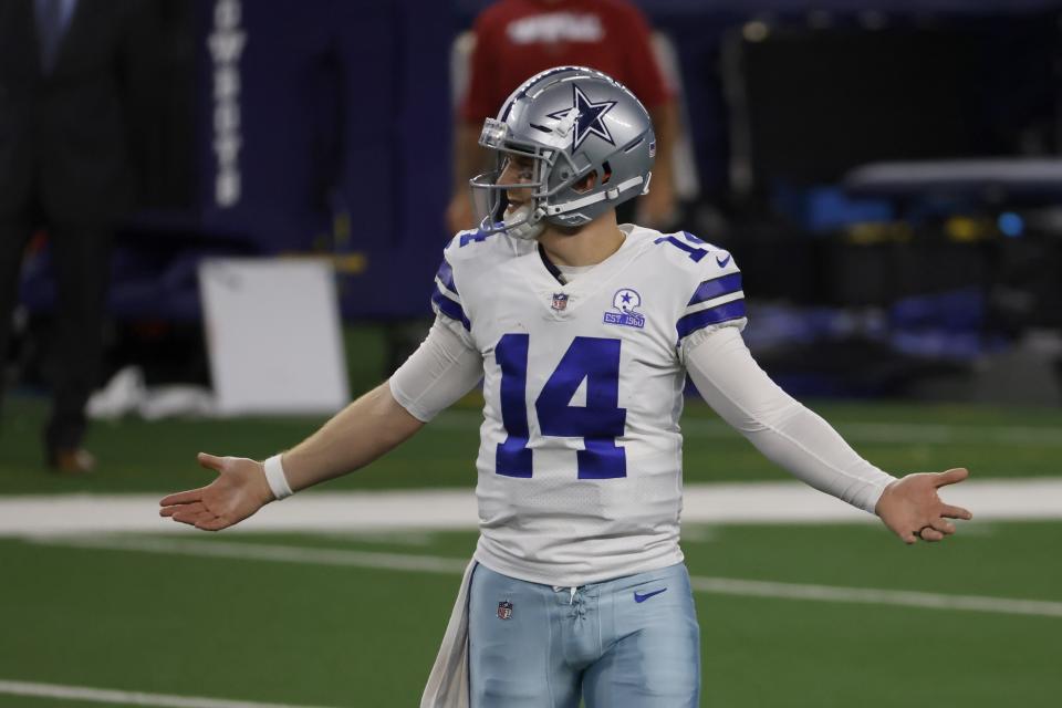 Dallas Cowboys quarterback Andy Dalton (14) gestures after throwing an interception in the second half of an NFL football game against the Arizona Cardinals in Arlington, Texas, Monday, Oct. 19, 2020. (AP Photo/Ron Jenkins)