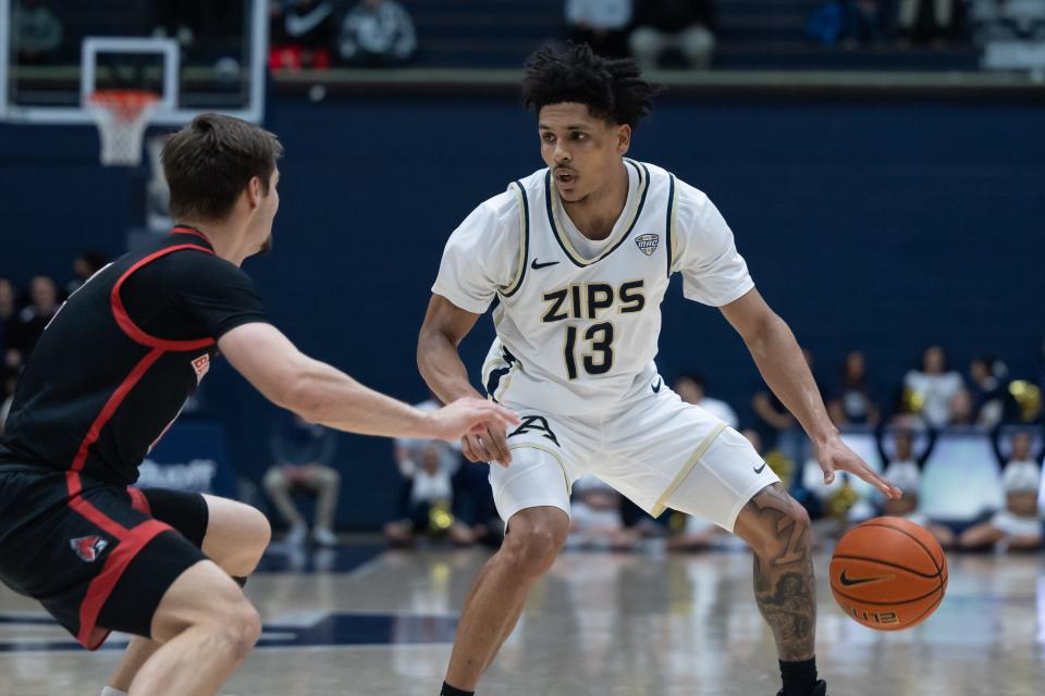 Akron's Xavier Castaneda dribble the ball as Ball State's Luke Bumbalough defends, Tuesday, Feb. 28, 2023, at Rhodes Arena.