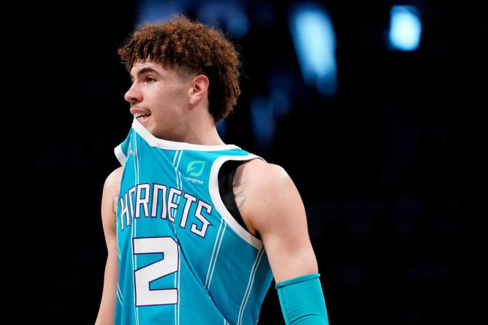 Charlotte Hornets guard LaMelo Ball walks the court during the first half of an NBA basketball game against the Brooklyn Nets, Sunday, Oct. 24, 2021, in New York. (AP Photo/John Minchillo)