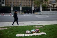 Floral tributes to killed British MP Amess outside parliament in London