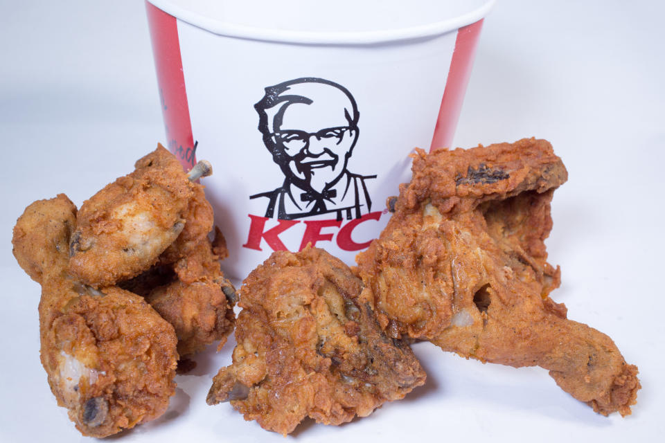 BRISTOL, ENGLAND - FEBRUARY 20:  In this photo illustration the KFC logo is pictured besides a selection of chicken pieces on February 20, 2018 in Bristol, England. KFC has been forced to close hundred of its outlets as a shortage of chicken, due to a failure at the company's new delivery firm DHL, has disrupted the fast-food giant's UK operation and is thought to be costing the fast food chain £1million a day.  (Photo by Matt Cardy/Getty Images)