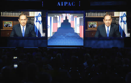 Israeli Prime Minister Benjamin Netanyahu speaks via a video link from Israel to the American Israel Public Affairs Committee (AIPAC) policy conference in Washington, U.S., March 27, 2017. REUTERS/Joshua Roberts