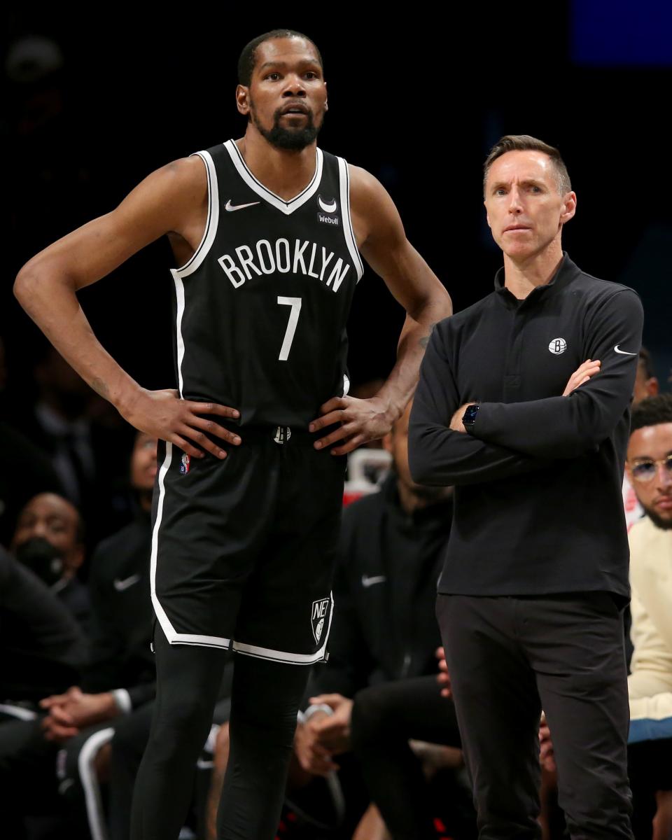 Brooklyn Nets forward Kevin Durant (left) and head coach Steve Nash look on during a game on March 29, 2022.
