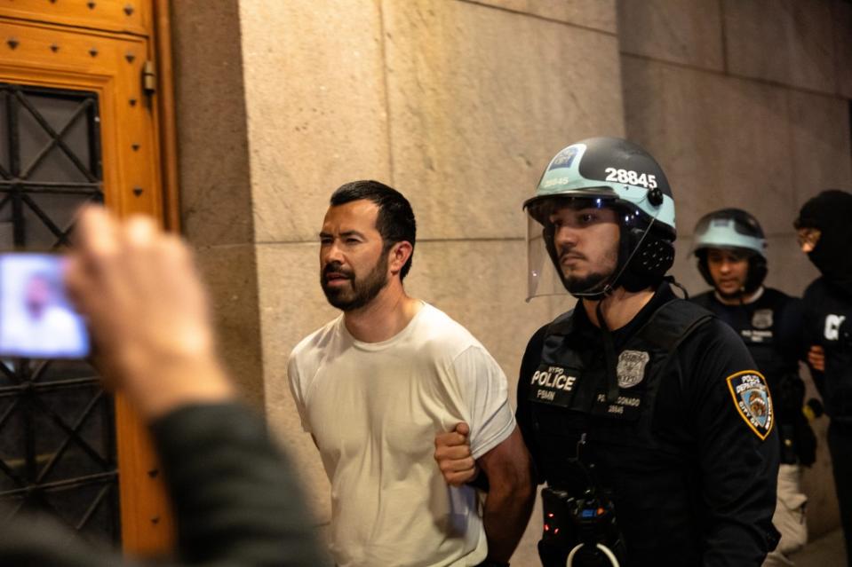 A NYPD officer arrests a protester Tuesday evening. Getty Images