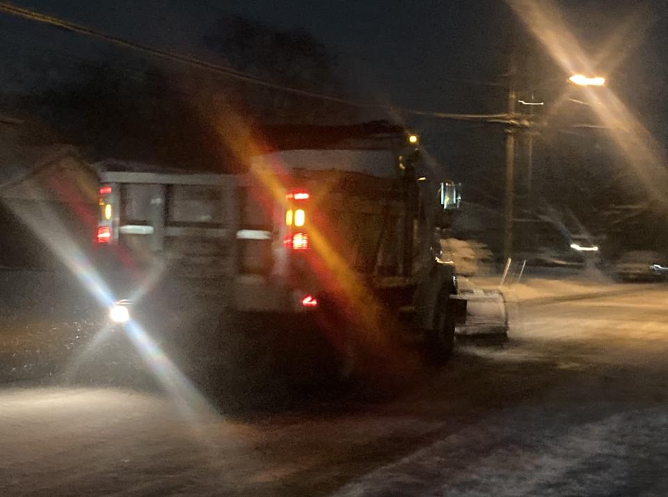 A snow plow helps clear Rhode Island Avenue in Cherry Hill on Friday night, Jan. 19, 2024.