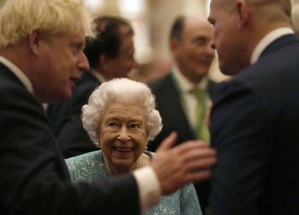 2021: Britain's Queen Elizabeth II and Prime Minister Boris Johnson, left, greet guests at a reception for the Global Investment Summit in Windsor Castle, Windsor, England, on Tuesday, Oct. 19, 2021.