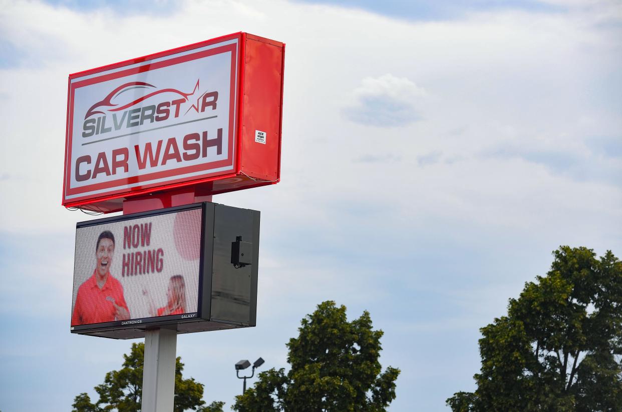 A "now hiring" message appears on the sign on Monday, August 23, 2021 at the Silverstar car wash on 41st Street in Sioux Falls.