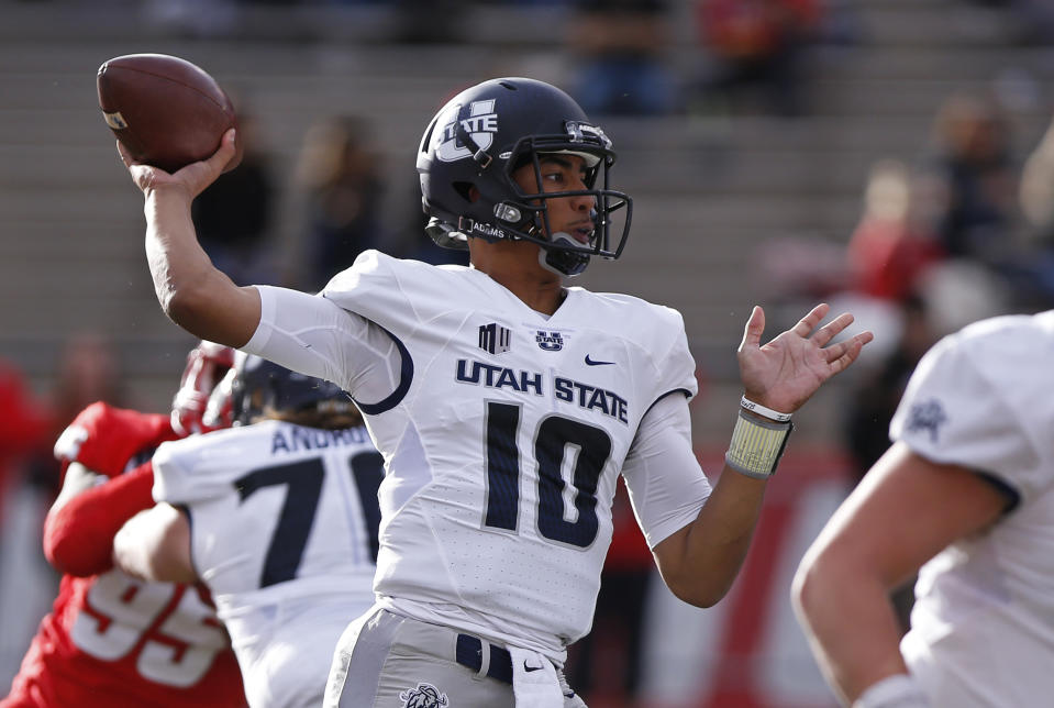 Utah State quarterback Jordan Love leads the highest-scoring offense in college football. (AP Photo/Andres Leighton)