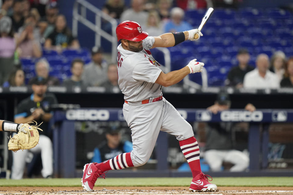 St. Louis Cardinals' Albert Pujols strikes out during the second inning of a baseball game against the Miami Marlins, Thursday, April 21, 2022, in Miami. (AP Photo/Lynne Sladky)