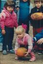 <p>Arrange bowling pins—or, if preferred, gourds—in a classic 10-pin formation, then watch as players roll a giant pumpkin down the makeshift lane. Line the path with hay bales for an extra country touch.</p>