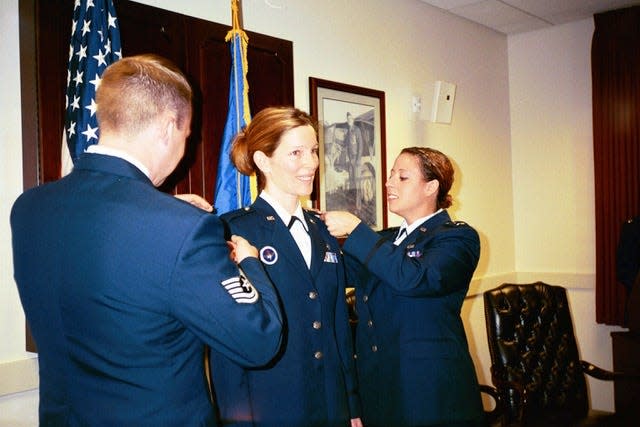 Ingrid Kaat (middle) is promoted to the rank of Captain in the U.S. Air Force.