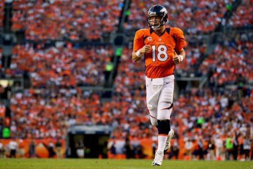 Quarterback Peyton Manning of the Denver Broncos runs onto the field during a game against the Pittsburgh Steelers at Sports Authority Field Field at Mile High on September 9, 2012 in Denver, Colorado. Denver beat the Steelers 31-19