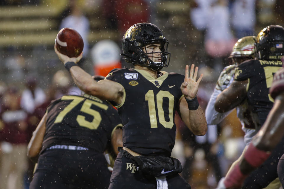 FILE - In this Saturday, Oct. 19, 2019, file photo, Wake Forest quarterback Sam Hartman looks to pass against Florida State in the second half of an NCAA college football game in Winston-Salem, N.C. The Demon Deacons have been to four straight bowl games but will have to overcome significant personnel losses on offense in coach Dave Clawson's seventh season. (AP Photo/Nell Redmond, File)