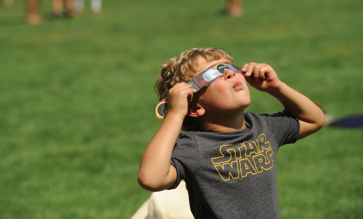 Logan Shainker of Newton used special solar glasses to look at a partial solar eclipse in 2017 at Heritage Museum and Gardens in Sandwich.