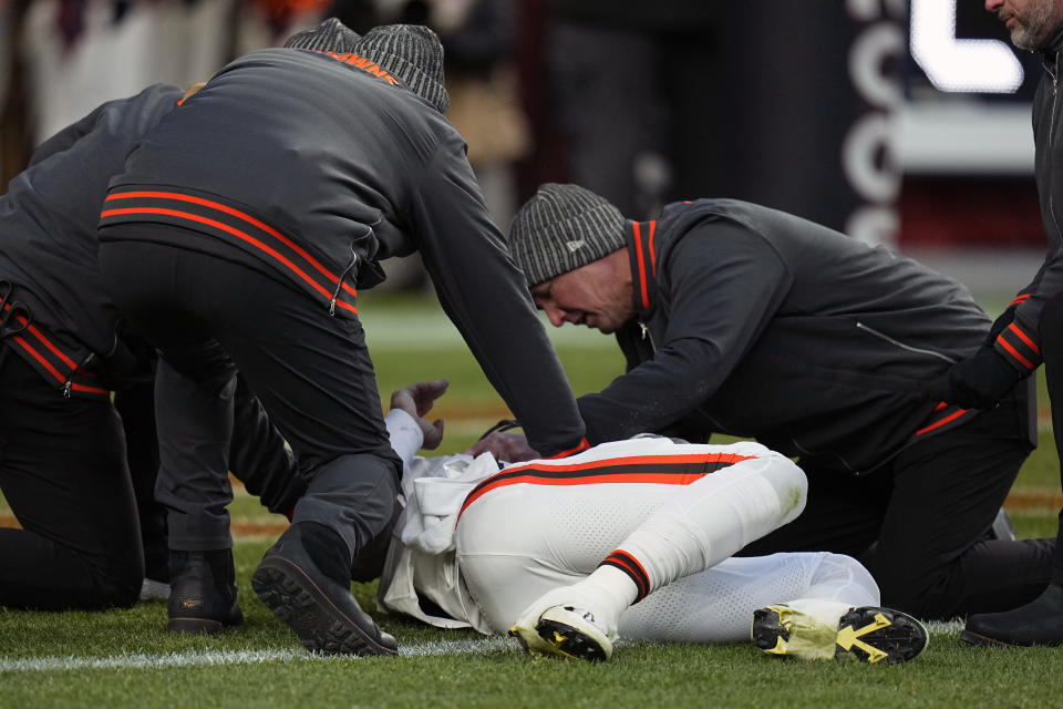 Cleveland Browns quarterback Dorian Thompson-Robinson is checked on after being injured during the second half of an NFL football game against the Denver Broncos on Sunday, Nov. 26, 2023, in Denver. (AP Photo/Jack Dempsey)