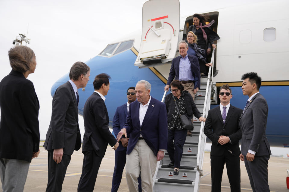 U.S. Senate Majority Leader Chuck Schumer, D-N.Y., center, and other members of the delegation arrive at Shanghai Pudong International Airport in Shanghai, China, Saturday, Oct. 7, 2023. (Aly Song/Pool Photo via AP)