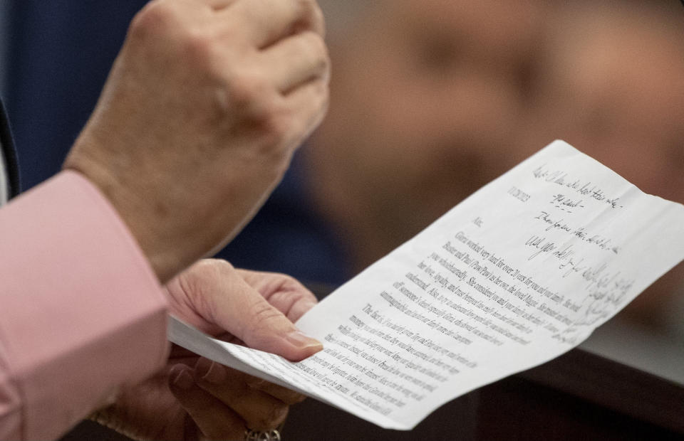 Ginger Hadwin, the sister of Gloria Satterfield, reads a letter to Alex Murdaugh during Murdaugh's sentencing for stealing from 18 clients, Tuesday, Nov. 28, 2023, at the Beaufort County Courthouse in Beaufort, S.C. (Andrew J. Whitaker/The Post And Courier via AP, Pool)