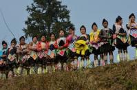 Local residents watch Chinese New Year buffalo fighting competition at the Miao Minority village of Biasha, in Guizhou Province, on February 4, 2014