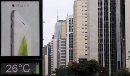 An advertisement board displays an iPhone 6 at Paulista avenue in Sao Paulo December 16, 2014. REUTERS/Paulo Whitaker