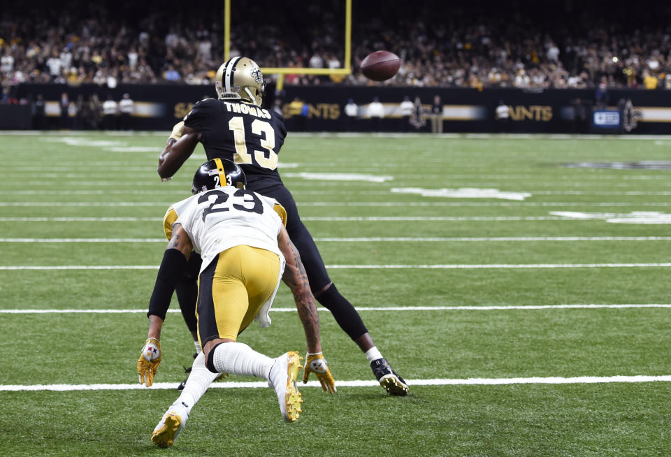 New Orleans Saints wide receiver Michael Thomas (13) pulls in a touchdown reception against Pittsburgh Steelers cornerback Joe Haden (23) in the second half of an NFL football game in New Orleans, Sunday, Dec. 23, 2018. (AP Photo/Bill Feig)