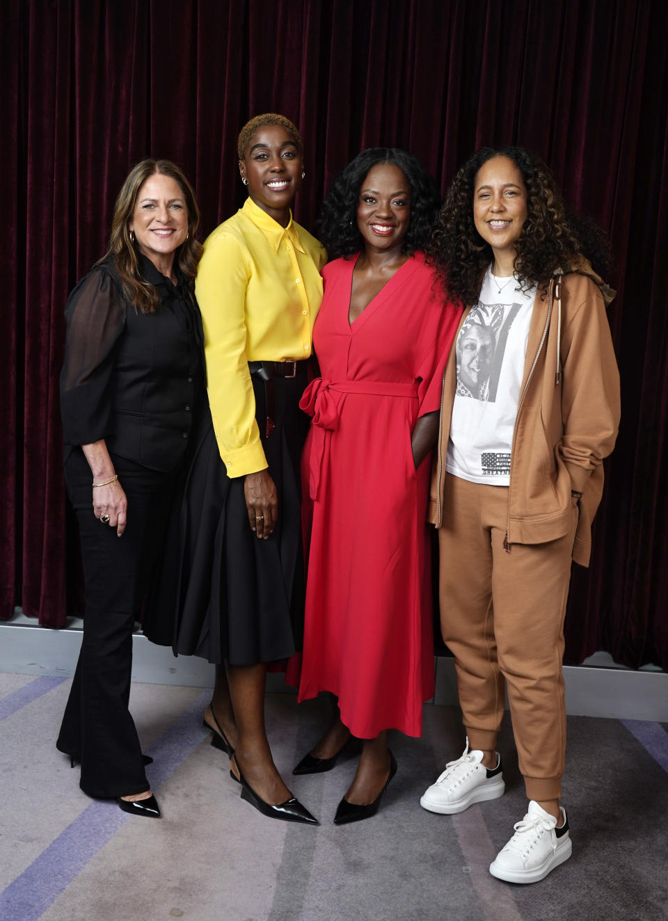 From left, Cathy Schulman, one of the producers of "The Woman King," cast members Lashana Lynch and Viola Davis, and director Gina Prince-Blythewood pose together for a portrait at the Ritz-Carlton Hotel, during the Toronto International Film Festival, Thursday, Sept. 8, 2022, in Toronto. (AP Photo/Chris Pizzello)