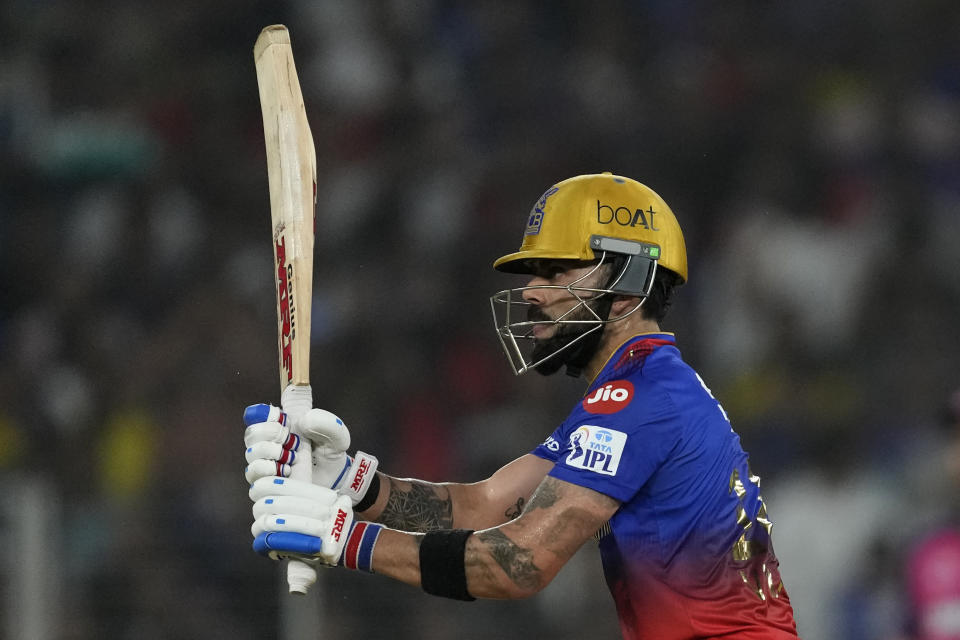 Royal Challengers Bengaluru's Virat Kohli watches the ball after playing a shot during the Indian Premier League eliminator cricket match between Royal Challengers Bengaluru and Rajasthan Royals in Ahmedabad, India, Wednesday, May 22, 2024. (AP Photo/Ajit Solanki)