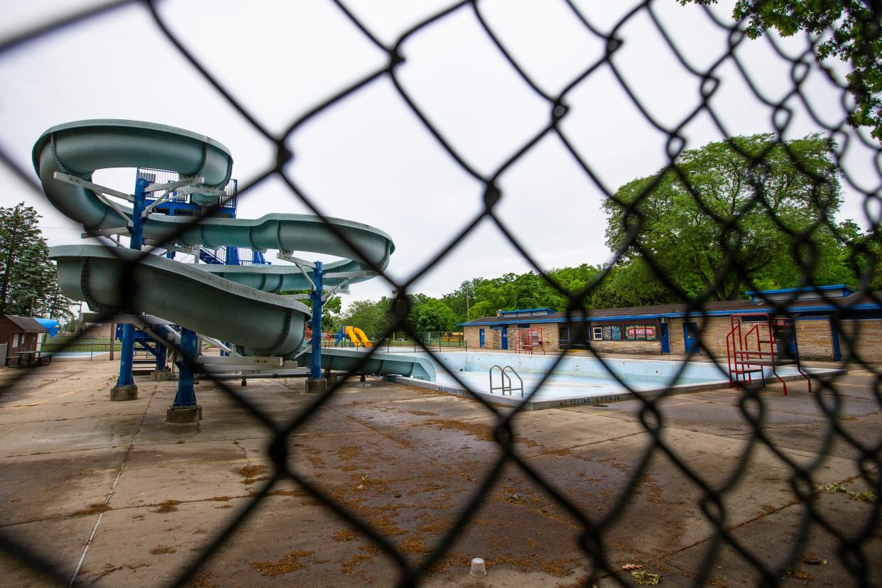 A view of the slide and pool deck Tuesday at Potawatomi Park pool in South Bend. The pool is closed indefinitely as the city considers long-term solutions to address the aging facility. Nearly 7,000 visitors went to the pool in 2021, according to the city.