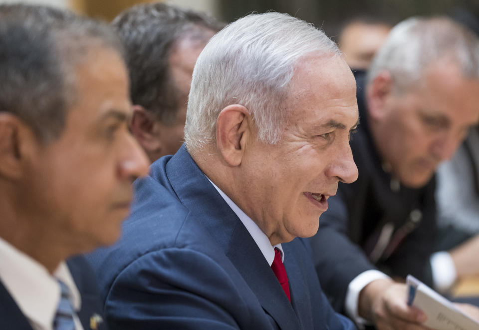 Israel's Prime Minister Benjamin Netanyahu listens speaks during the meeting with Lithuania's Prime Minister Saulius Skvernelis at the government's headquarters in Vilnius, Lithuania, Thursday, Aug. 23, 2018. Netanyahu arrived in Lithuania Thursday for a four-day visit during which he will also meet his Latvian and Estonian counterparts, local officials and the Jewish community. (AP Photo/Mindaugas Kulbis)