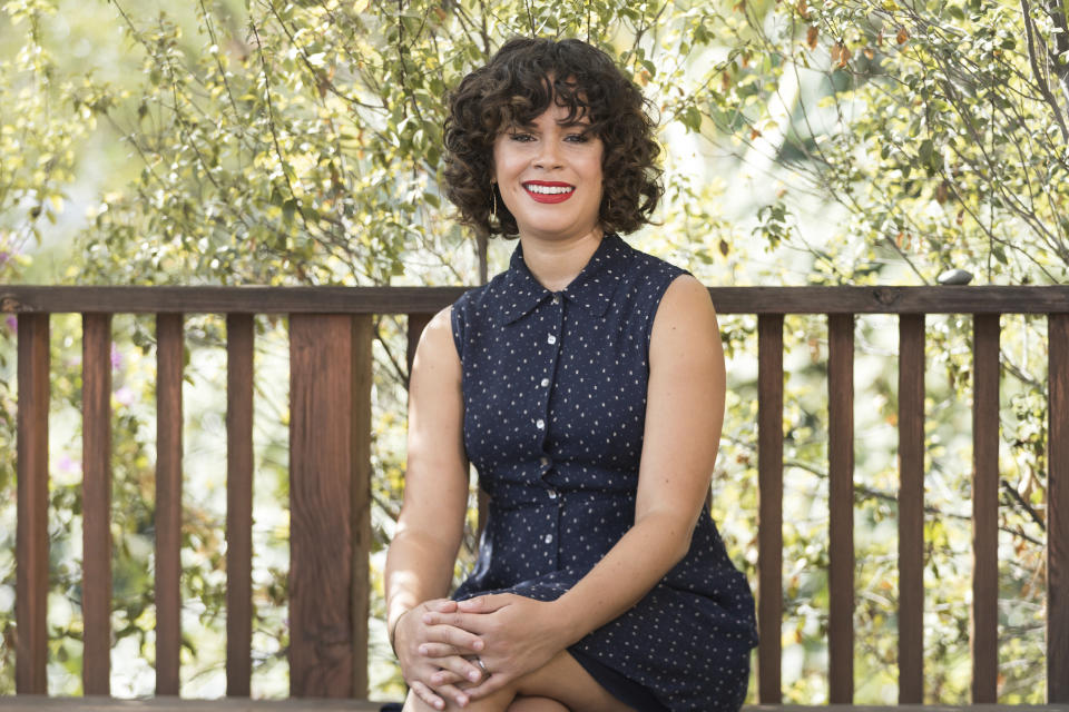 Charise Castro Smith poses for a portrait on Sept. 9, 2021, in Los Angeles to promote her Disney animated film "Encanto." The film, which she co-directs with Jared Bush and Byron Howard, is set in Colombia and follows a teenage girl dealing with the frustration of being the only member of her family without magical powers. (Photo by Willy Sanjuan/Invision/AP)