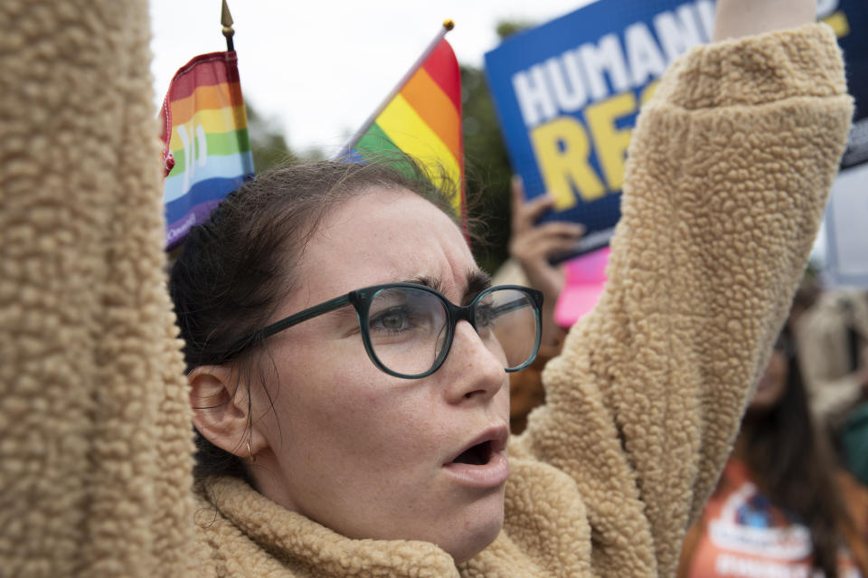 Madeline Stern from Phoenix, Ariz., join other LGBT supporters in front of the U.S. Supreme Court, Tuesday, Oct. 8, 2019, in Washington. The Supreme Court is set to hear arguments in its first cases on LGBT rights since the retirement of Justice Anthony Kennedy. Kennedy was a voice for gay rights while his successor, Brett Kavanaugh, is regarded as more conservative. (AP Photo/Manuel Balce Ceneta)