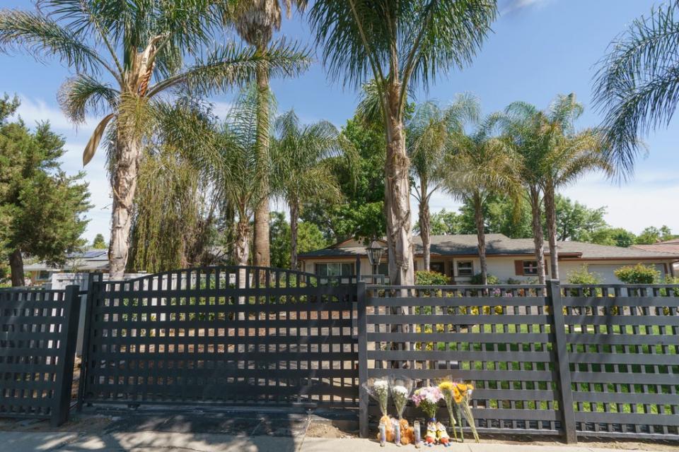 Flowers and teddy bears are left outside a ranch-style house in the West Hills neighborhood of the San Fernando Valley in Los Angeles, Monday, May 9, 2022. (Copyright 2022 The Associated Press. All rights reserved.)