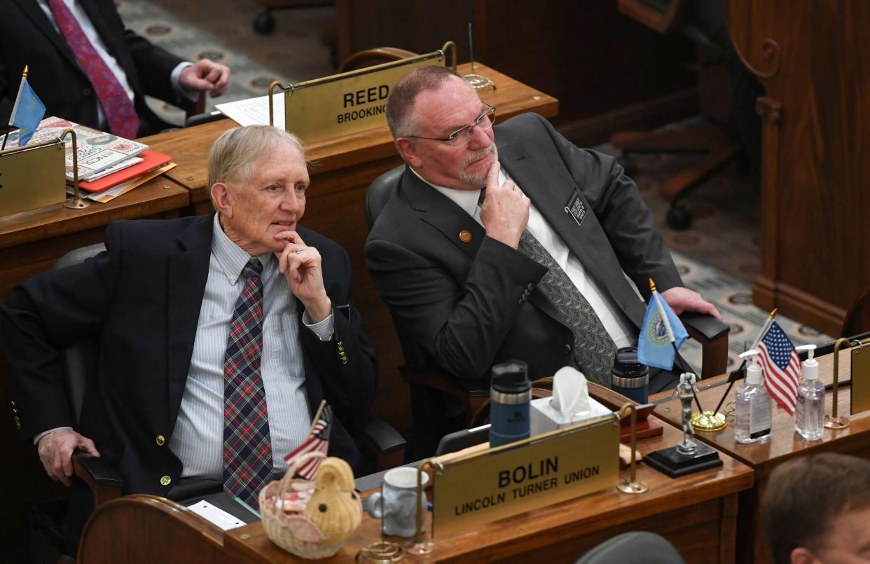 S.D. Senators Jim Bolin and Randy Deibert listen during proceedings on the first day of the legislative session on Tuesday, January 10, 2023, at the South Dakota State Capitol in Pierre.