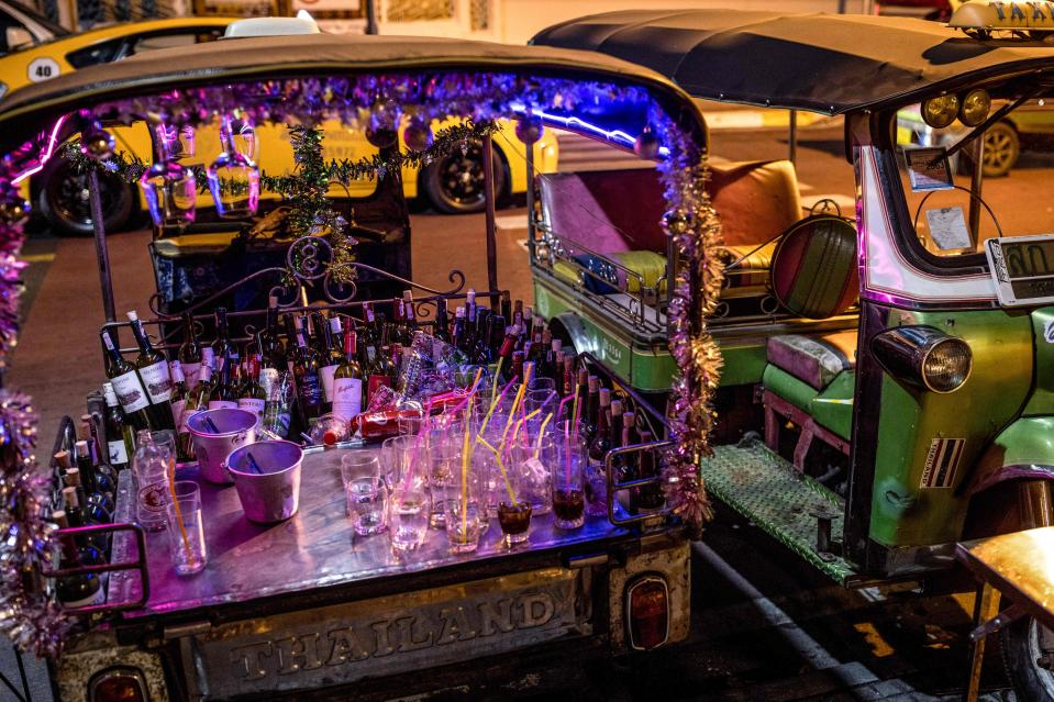 Bottles of wine are pictured in the back of a tuk tuk during New Year celebrations in Bangkok (AFP via Getty Images)