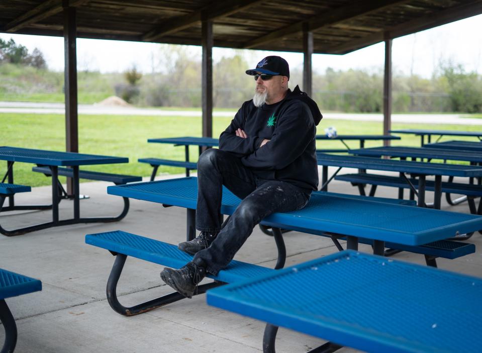 Brian Cash poses for a photo at a pavilion behind The South Lyon Fire Department on May 5, 2020. Cash is the man from the Michigan Capitol protest photos who appears to be yelling at two MSP troopers and is being mistaken for a white supremacist from LA on Twitter.