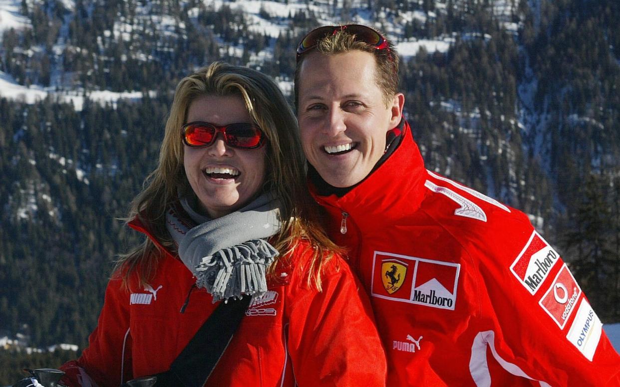 German Formula 1 driver Michael Schumacher poses with his wife Corinna, in the winter resort of Madonna di Campiglio, in the Dolomites area, Northern Italy