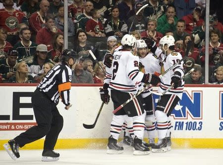 May 5, 2015; Saint Paul, MN, USA; Chicago Blackhawks defenseman Duncan Keith (L) and forward Patrick Sharp(R) congratulate forward Patrick Kane (C) on his goal during the first period in game three of the second round of the 2015 Stanley Cup Playoffs at Xcel Energy Center. Mandatory Credit: Marilyn Indahl-USA TODAY Sports