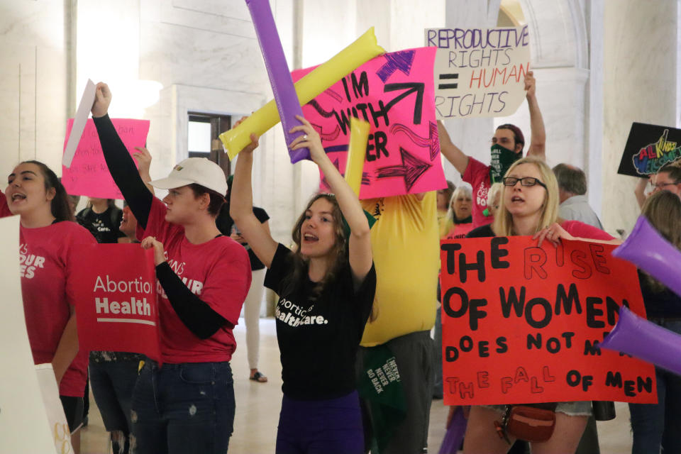 Protestors rally outside the Senate chamber at the West Virginia state Capitol in Charleston, W.Va., as lawmakers debated a sweeping bill to ban abortion in the state with few exceptions on Tuesday, Sept. 13, 2022. Several Republican lawmakers have said they hope the bill will make it impossible for the state's only abortion clinic to continue to offer the procedure. (AP Photo/Leah Willingham)