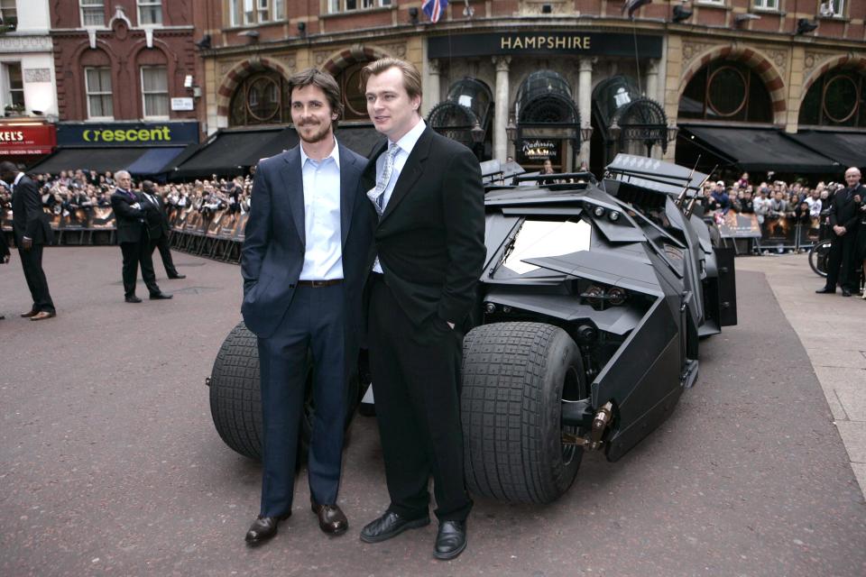 Star of the film Christian Bale (left) with director Chrispoher Nolan and the new Batmobile.   (Photo by Edmond Terakopian - PA Images/PA Images via Getty Images)