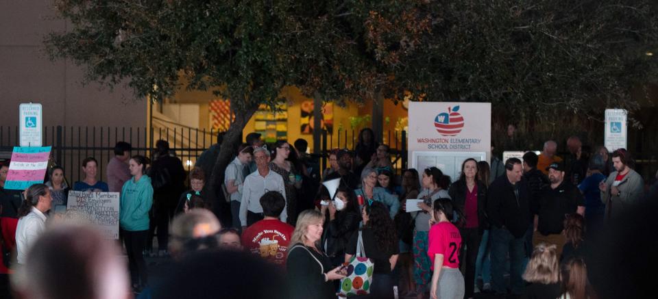 March 9, 2023; Glendale, AZ, USA; People protest at the Washington Elementary School District office on March 9, 2023, in Glendale. Mandatory Credit: Mingson Lau/The Republic