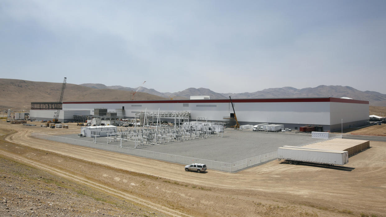 FILE - An overall view of the new Tesla Gigafactory is seen during a media tour Tuesday, July 26, 2016, in Sparks, Nev. Tesla will get more than $330 million in tax breaks from Nevada to massively expand its vehicle battery facility east of Reno and add a new electric semi-truck factory. Approval on Thursday, March 2, 2023, from the Governor's Office of Economic Development came as Republican Gov. Joe Lombardo cited the benefit of jobs and the boost that Tesla's huge Gigafactory has given the local economy for almost a decade. (AP Photo/Rich Pedroncelli, File)