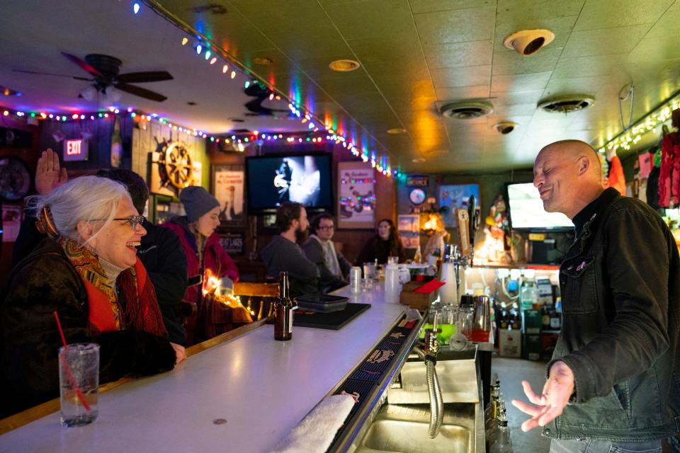 Hamtramck Mayor Karen Majewski ,left,  speaks with Jon Piepenbrok during her campaign stop at Whiskey In the Jar in Hamtramck on Nov. 2, 2021.