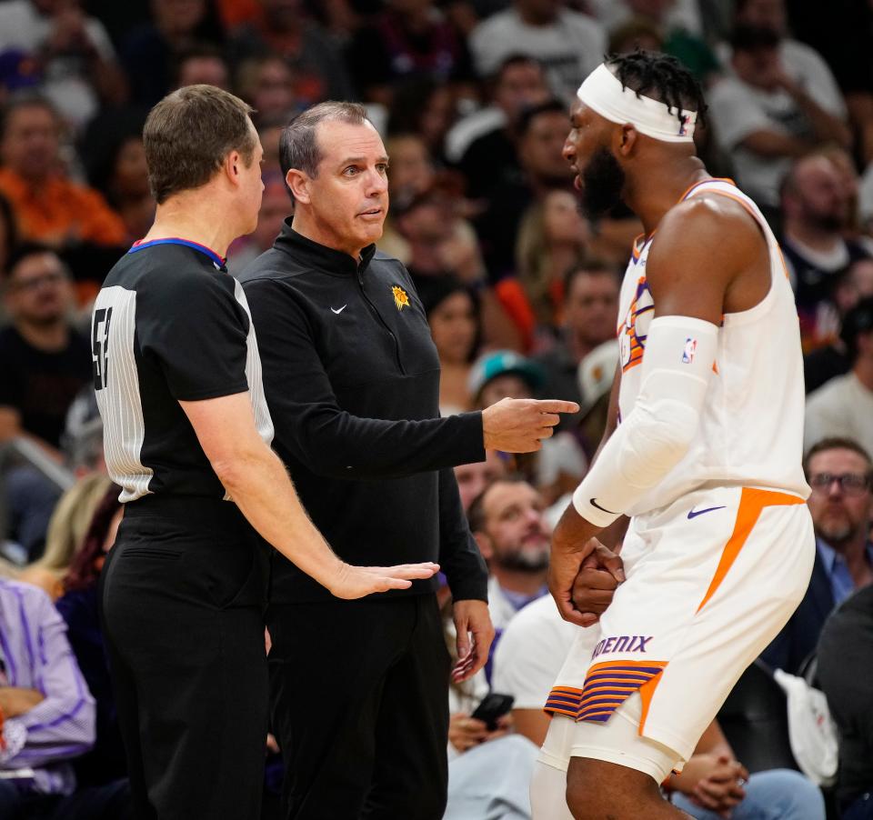 Phoenix Suns wing Josh Okogie, head coach Frank Vogel and an official discuss a technical foul called on Okogie for flopping during a 2023-24 NBA game. The NFHS has issued a new rule to combat the spread of flopping to the high school game.