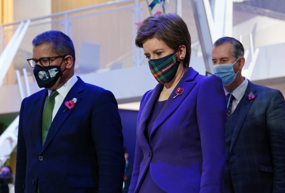 Cop26 President Alok Sharma (front left) and First Minister Nicola Sturgeon observe a two minute silence on Armistice Day (Jane Barlow/PA) (PA Wire)