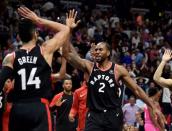 Dec 26, 2018; Miami, FL, USA; Toronto Raptors forward Kawhi Leonard (right) celebrates with guard Danny Green (left after defeating the Miami Heat at American Airlines Arena. Mandatory Credit: Steve Mitchell-USA TODAY Sports